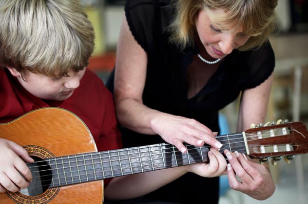child-taking-music-lessons